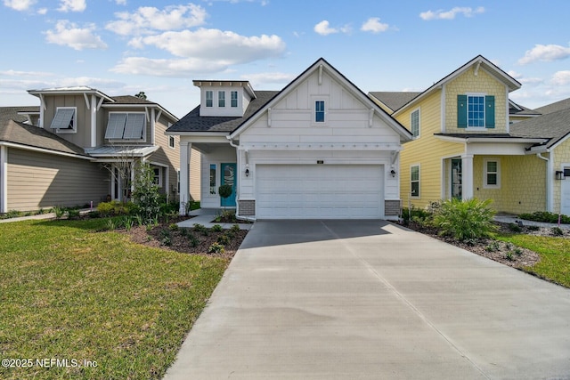 view of front of home featuring board and batten siding, a front yard, and driveway