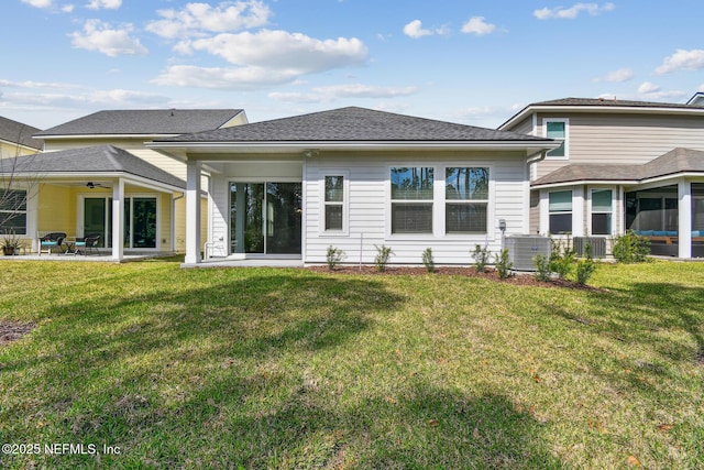 rear view of house featuring ceiling fan, central AC unit, a lawn, and a patio area