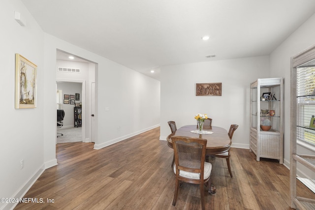 dining space featuring dark hardwood / wood-style floors