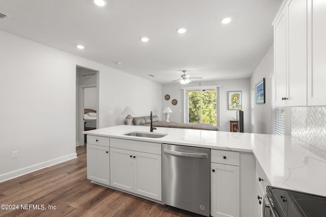 kitchen featuring white cabinetry, stainless steel dishwasher, dark wood-type flooring, and sink