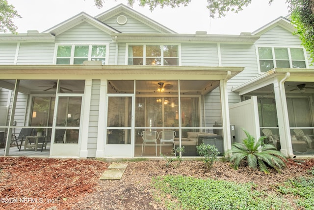 back of property featuring a sunroom