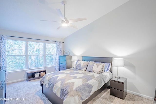 carpeted bedroom featuring ceiling fan and vaulted ceiling