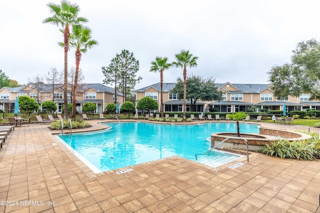 view of swimming pool with a patio area