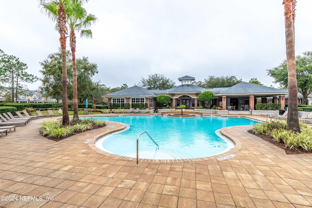 view of swimming pool featuring a patio area