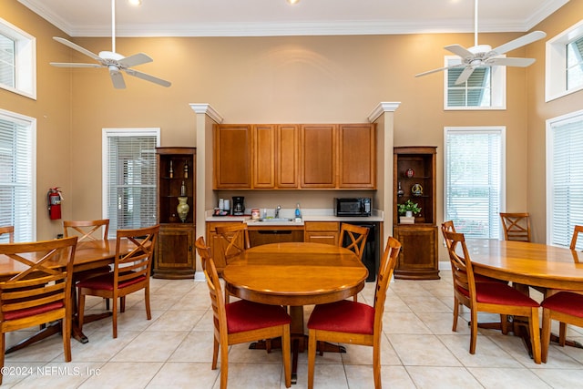 dining room featuring ceiling fan, light tile patterned flooring, and ornamental molding