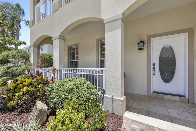 doorway to property featuring a porch