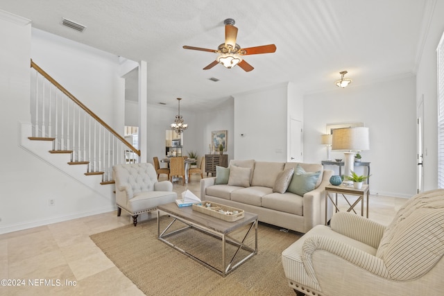 tiled living room with a textured ceiling, crown molding, and ceiling fan with notable chandelier