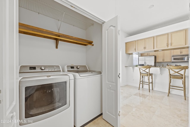 washroom with independent washer and dryer