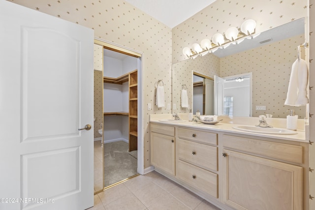 bathroom with tile patterned flooring and vanity