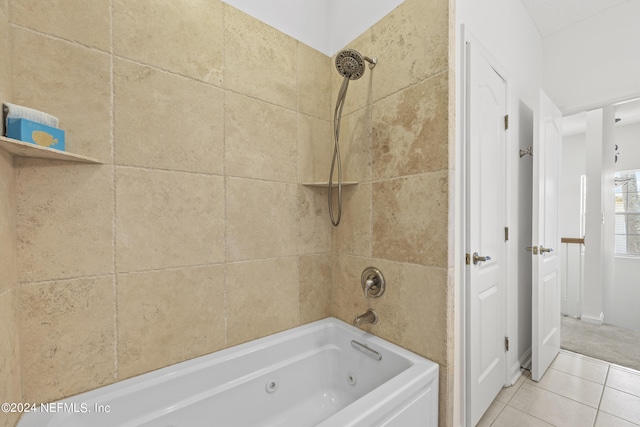 bathroom with tile patterned flooring and tiled shower / bath