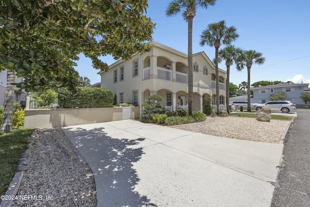 view of front of home with a balcony