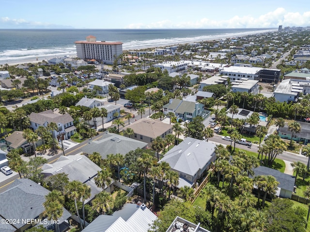 bird's eye view with a water view and a beach view