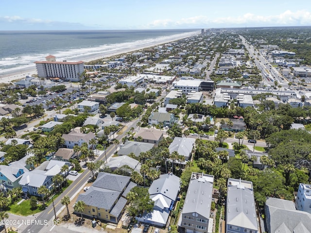 aerial view with a water view and a view of the beach