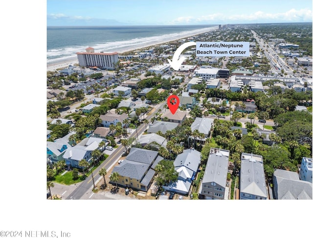 aerial view with a water view and a beach view