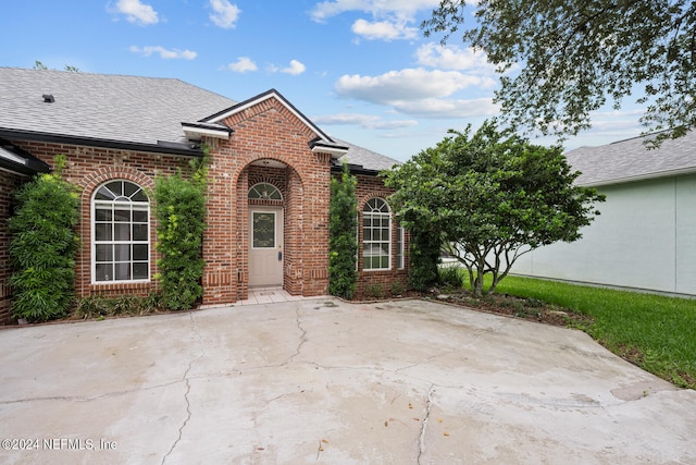 view of property featuring a patio area