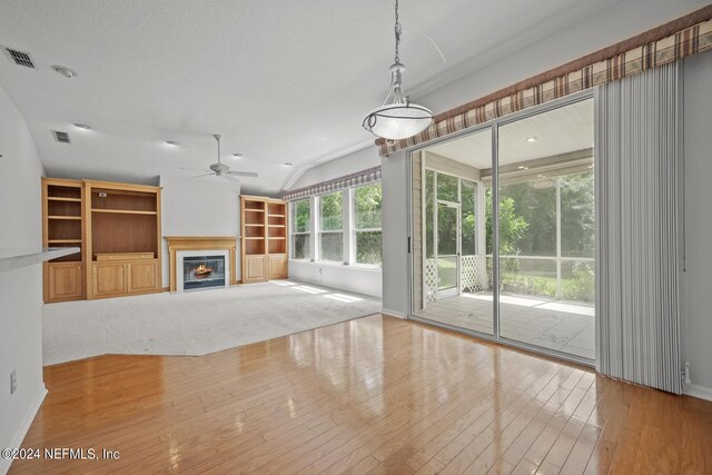 unfurnished living room with light hardwood / wood-style floors and ceiling fan