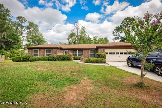 single story home with a front lawn and a garage