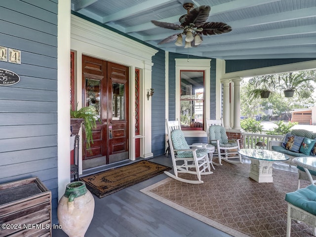 doorway to property with ceiling fan, french doors, and a porch