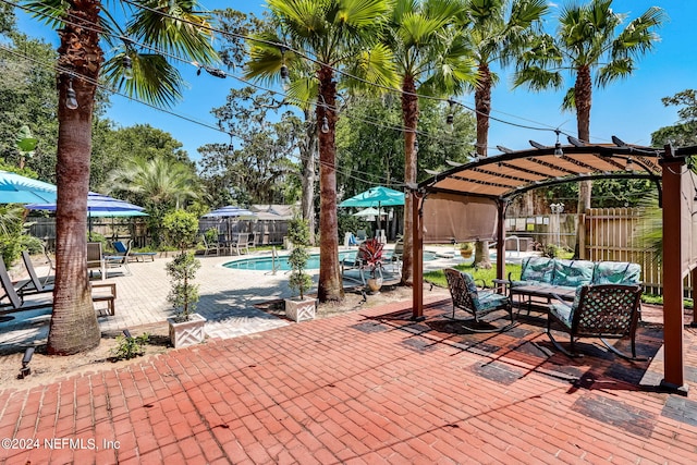 view of patio featuring a pergola and a fenced in pool