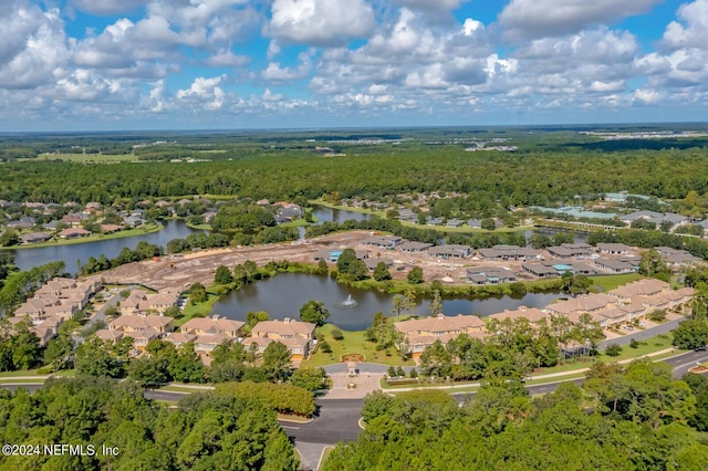 bird's eye view featuring a residential view, a water view, and a wooded view