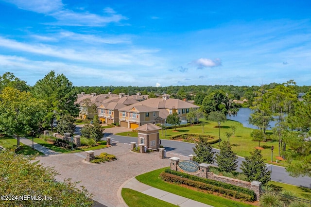 view of property's community with a residential view and a water view