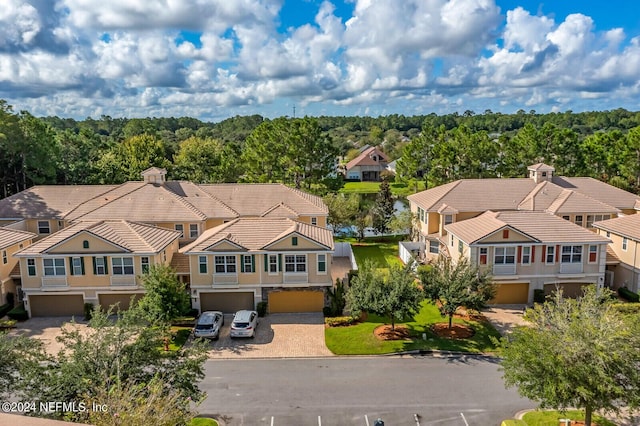 bird's eye view with a residential view and a view of trees