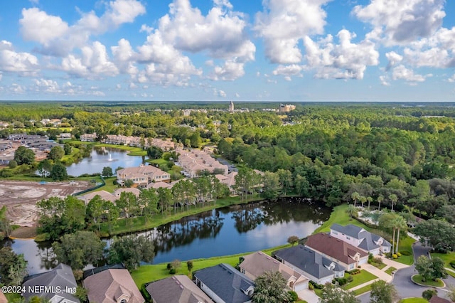 aerial view with a residential view, a water view, and a wooded view