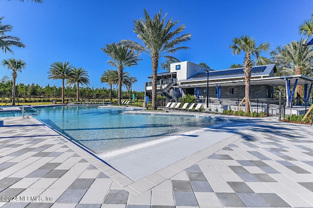 view of swimming pool featuring a patio