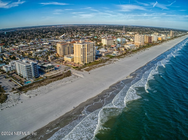 bird's eye view featuring a water view and a view of the beach