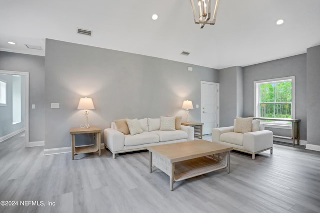 living area featuring recessed lighting, wood finished floors, visible vents, and baseboards