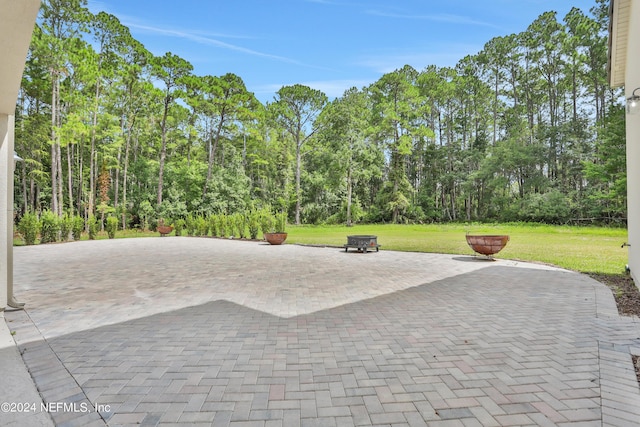 view of patio / terrace featuring a fire pit