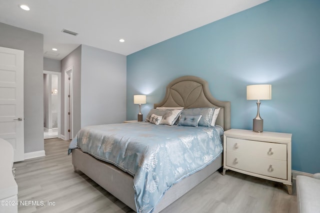 bedroom featuring baseboards, visible vents, wood finished floors, and recessed lighting