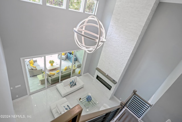 living room featuring a chandelier and tile patterned floors