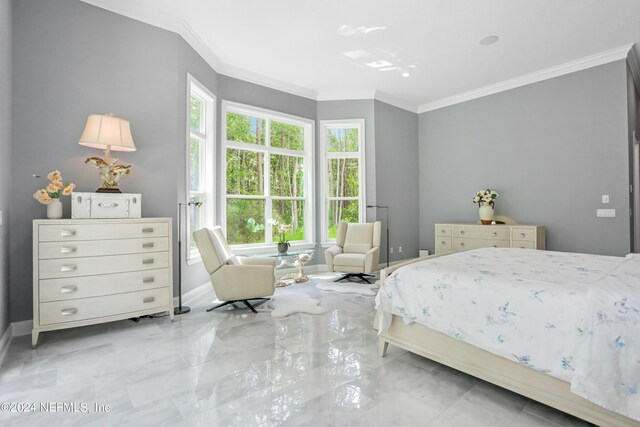 bedroom featuring ornamental molding, marble finish floor, and baseboards