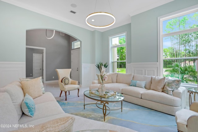 living room featuring carpet flooring and crown molding