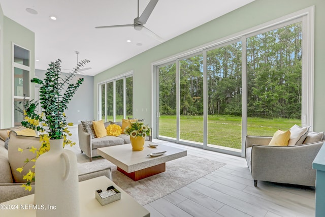 sunroom / solarium featuring ceiling fan and a healthy amount of sunlight