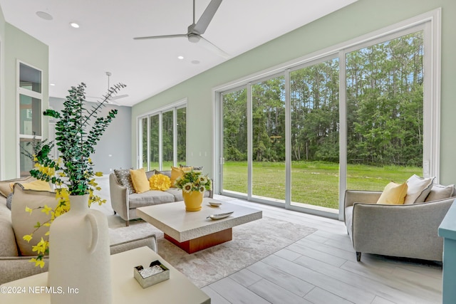 sunroom featuring ceiling fan