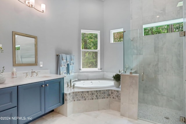 bathroom with tile patterned flooring, vanity, and plus walk in shower