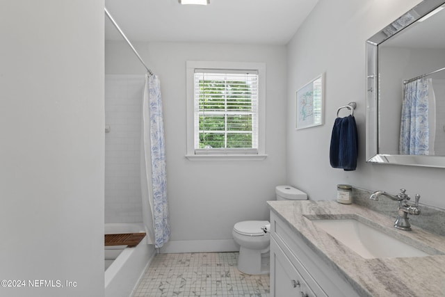 bathroom featuring vanity, toilet, and curtained shower