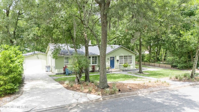 single story home with a garage and a front yard