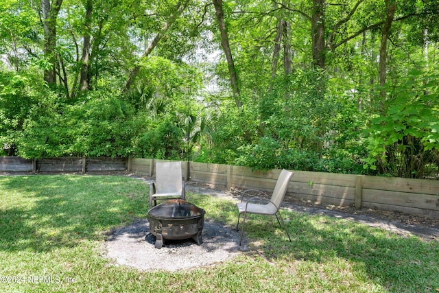 view of yard featuring a fire pit