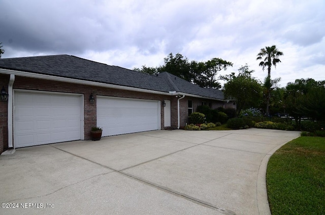 view of side of property with a garage