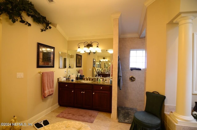 bathroom featuring vanity, tile patterned floors, crown molding, decorative columns, and a tile shower