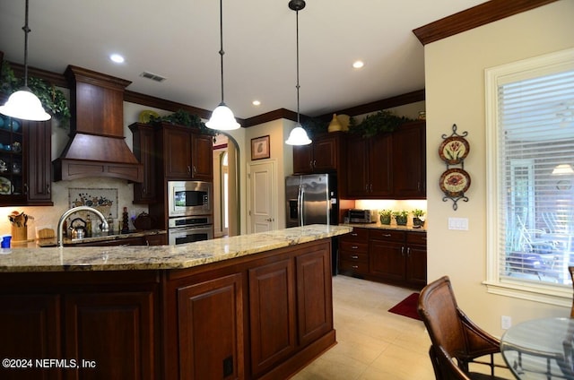 kitchen with pendant lighting, custom exhaust hood, stainless steel appliances, tasteful backsplash, and ornamental molding