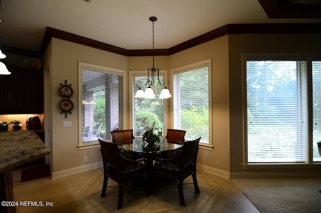 dining room with ornamental molding, a notable chandelier, and a healthy amount of sunlight