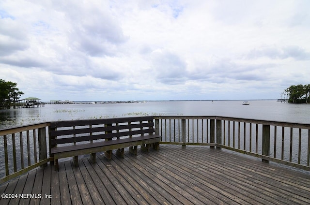 view of dock featuring a deck with water view