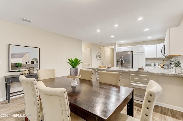 dining room featuring light hardwood / wood-style floors