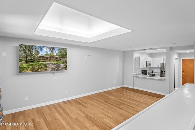 unfurnished living room featuring light wood-type flooring