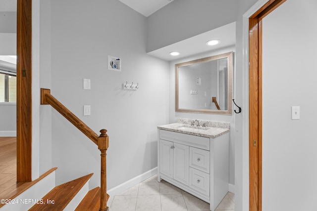 bathroom with tile patterned flooring and vanity