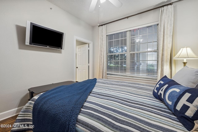 bedroom featuring hardwood / wood-style flooring and ceiling fan